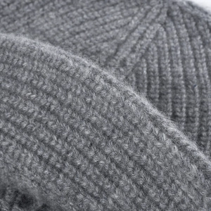 Thick grey wool knit fisherman beanie with ribbed texture for winter warmth