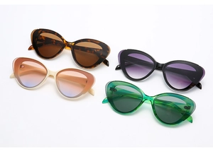 Detailed display of vintage cat eye sunglasses in tortoiseshell, white, black, and green