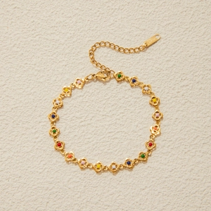 Detail of golden stainless steel clover bracelet with multi-color beads and lobster clasp