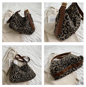 Detailed views of leopard print canvas tote bag with brown leather strap and gold hardware
