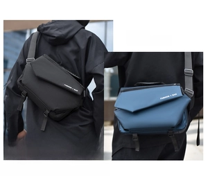 Detail of geometric crossbody bag flap with fashion text and adjustable wide strap