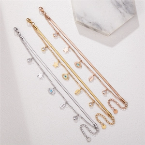 Double-layered evil eye and star charm bracelets in gold, silver, and rose gold finishes