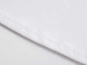 Detailed close-up of double-needle stitching and fine knit texture on a white sports tank top