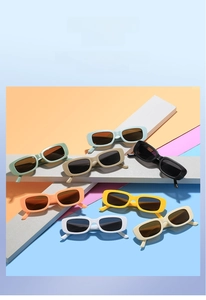 Selection of eight colorful rectangular children sunglasses on geometric display props
