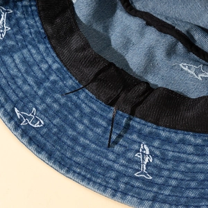 Detailed close-up of the adjustable inner drawstring and sweatband in denim bucket hat