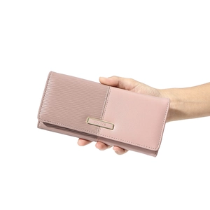 Close-up of pink long patchwork wallet showing smooth and textured PU leather details