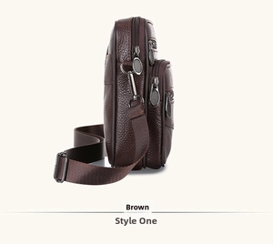 Detailed side view of brown genuine leather shoulder bag with multi-layer zippers