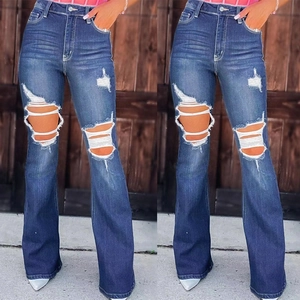 High-waisted distressed flare jeans for women featuring heavy ripped knees in dark blue denim