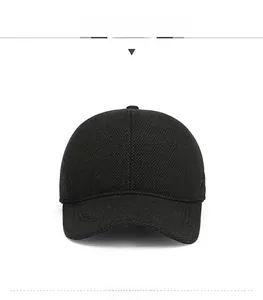 Front view of black winter baseball cap featuring thick knitted texture and curved brim