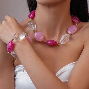 Detail of chunky acrylic marbled beads on necklace and bracelet set for women