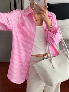 Women's pink striped button-down shirt with long sleeves for casual vacation style