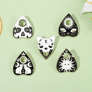 Gothic enamel pin set with black and white skull and mystical cat designs for accessories