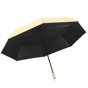 Three-fold manual umbrella with beige exterior, black UV coating, and wooden handle
