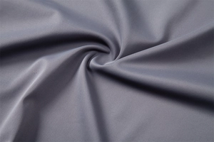 Macro shot of high-density grey UV protection fabric showing twill weave texture