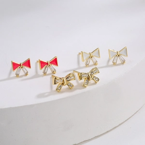 Three bow knot stud earrings in red, white enamel and gold-plated cubic zirconia pavé