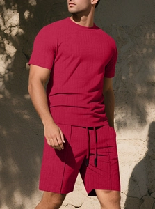 Detailed macro view of dark red men's textured knit summer t-shirt and shorts set