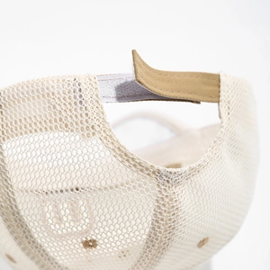 Detail of breathable mesh kids cap with adjustable khaki hook-and-loop strap