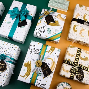 Leopard and geometric gift wrapping paper set with silk ribbons and thank you tags