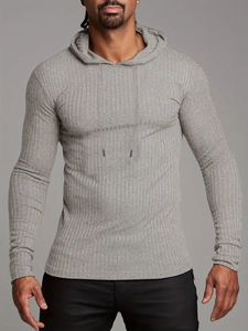 Close-up of gray slim fit ribbed knit hoodie featuring drawstring hood and muscle fit design