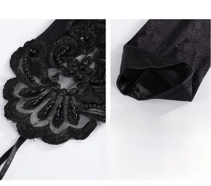 Close-up of black bridal gloves featuring handmade beads, sequins, and lace floral embroidery