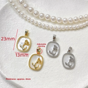 Macro detail of 14k gold rose pendant with white mother of pearl and dimensions