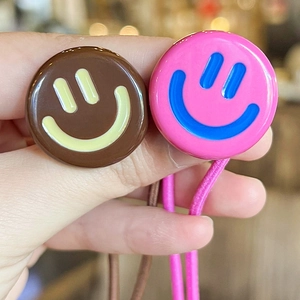 Colorful smiley face hair ties in pink and brown with high elasticity for ponytails