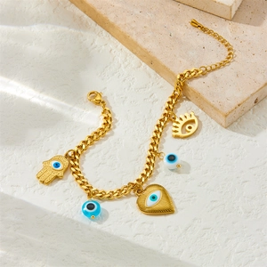 Gold stainless steel chain bracelet with bohemian evil eye and hamsa hand pendants