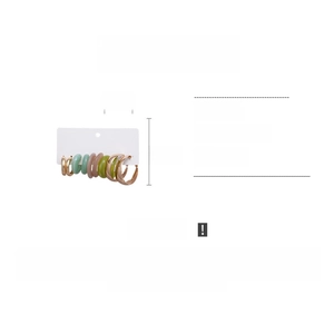 Detailed view of 10-piece acrylic and gold metal hoop earrings set, 3.5cm diameter