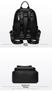 Detail view showing back anti-theft zipper pocket and flat bottom of black leather backpack