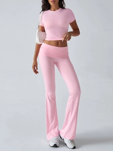 Detail of pink short-sleeve T-shirt and high-waisted flared trousers casual set