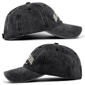 Detail of vintage washed gray baseball cap showing Los Angeles embroidery and fabric texture