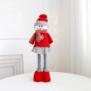 Detail of a plush Christmas snowman doll in a red knit sweater with long spindly legs