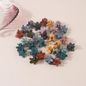 Set of mini flower hair claws in assorted Morandi colors for versatile hairstyling