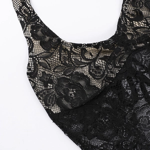 Détails rapprochés du tissu en dentelle noire avec broderie florale ajourée