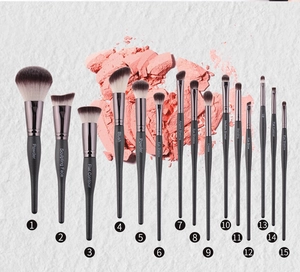 Detail of 15-piece black professional makeup brush set for face and eye makeup application