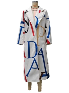 Detailed close-up of white oversized lapel coat with artistic color block letter prints