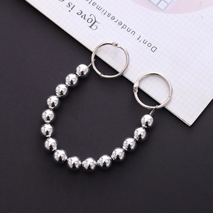Detail showing high-polish silver metal bead chain with rings for DIY shoe charms
