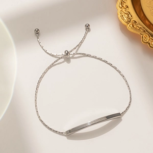 Adjustable silver polished bracelet featuring Lover Dream engraved metal bar for women