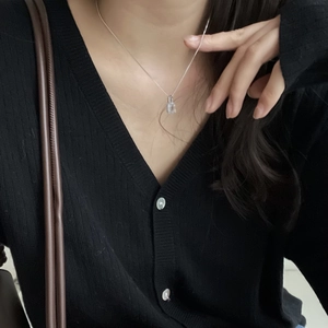 Elegant 925 sterling silver mini padlock necklace with zircon on a female model