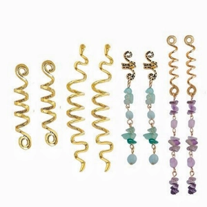 Detail of spiral gold earrings with irregular light blue and purple natural stone pendants