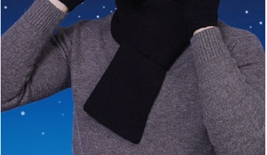 Close-up of black ribbed knit scarf showing thick wool texture and warm winter weave