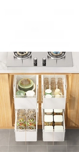 Pull-out kitchen drawer organizer in white carbon steel showing multi-layer cabinet storage