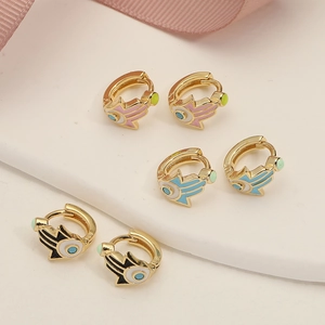 Golden Evil Eye and Hamsa Hand hoop earrings set in pink, blue, and black enamel