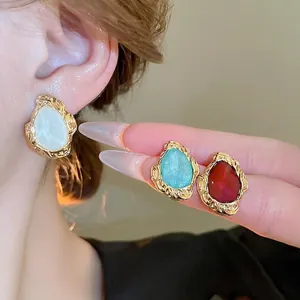 Vintage geometric lava gold earrings with ivory, turquoise, and ruby teardrop stones