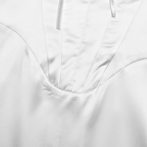 Detailed view of white satin dress with square neck pleats and thin shoulder straps