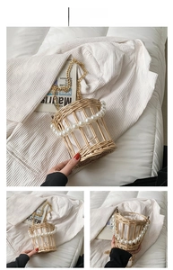 Detail of woven straw bucket bag with faux pearl trim and golden chain strap