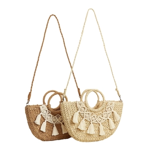 Minimalist semi-circular straw woven handbag with tassels and top handle in two colors