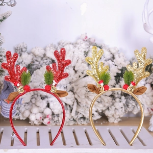 Detail of Christmas reindeer antler headbands with glitter, berries, and bells for parties