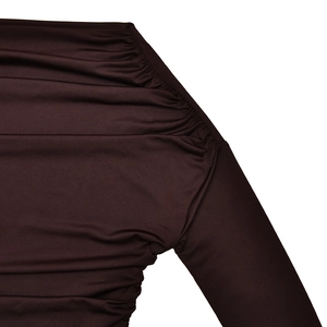Close-up of ruched shoulder detail and elastic fabric texture on dark brown slim fit top