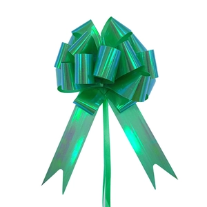 Macro shot of green metallic gift bow with holographic shine on a white background